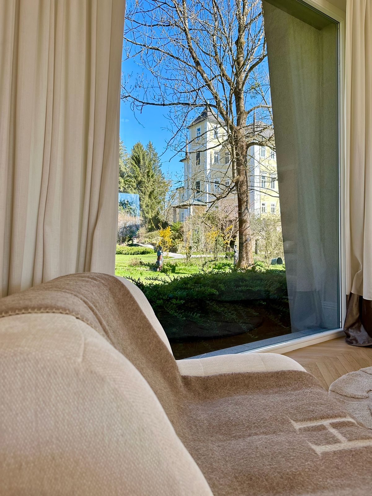 Bedroom with a window onto one of the estate towers