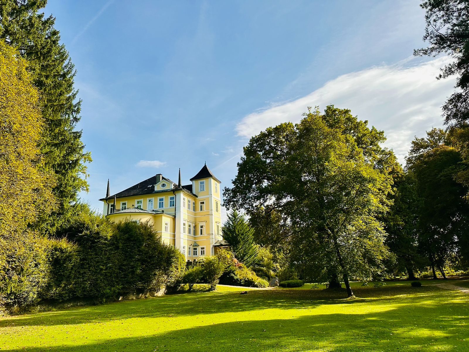 The main residence seen across the lawn
