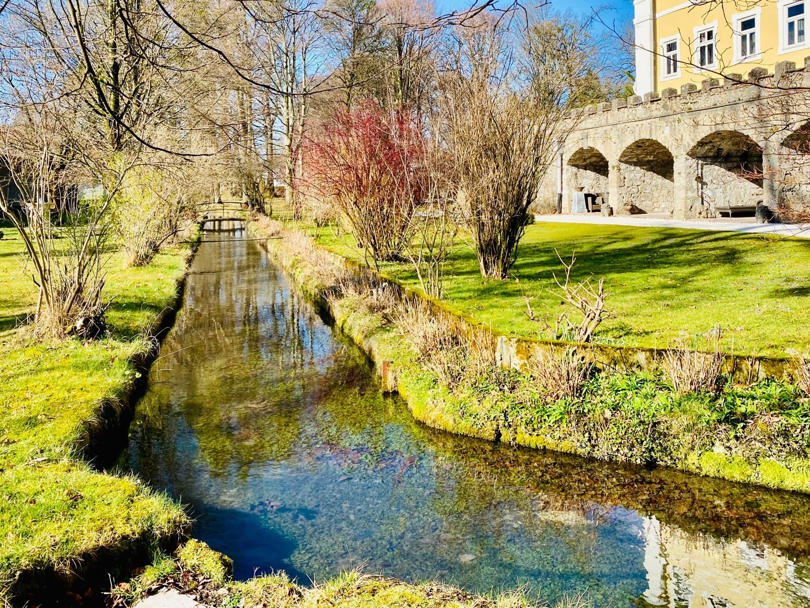 Stream flowing alongside the arcaded walled garden