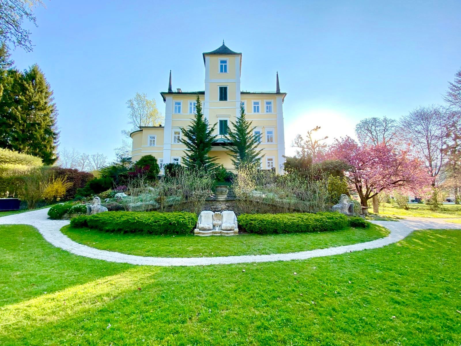 Axial view of the main residence across the oval lawn
